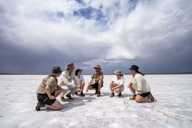 Tour group on a salt lake in Central Australia.
